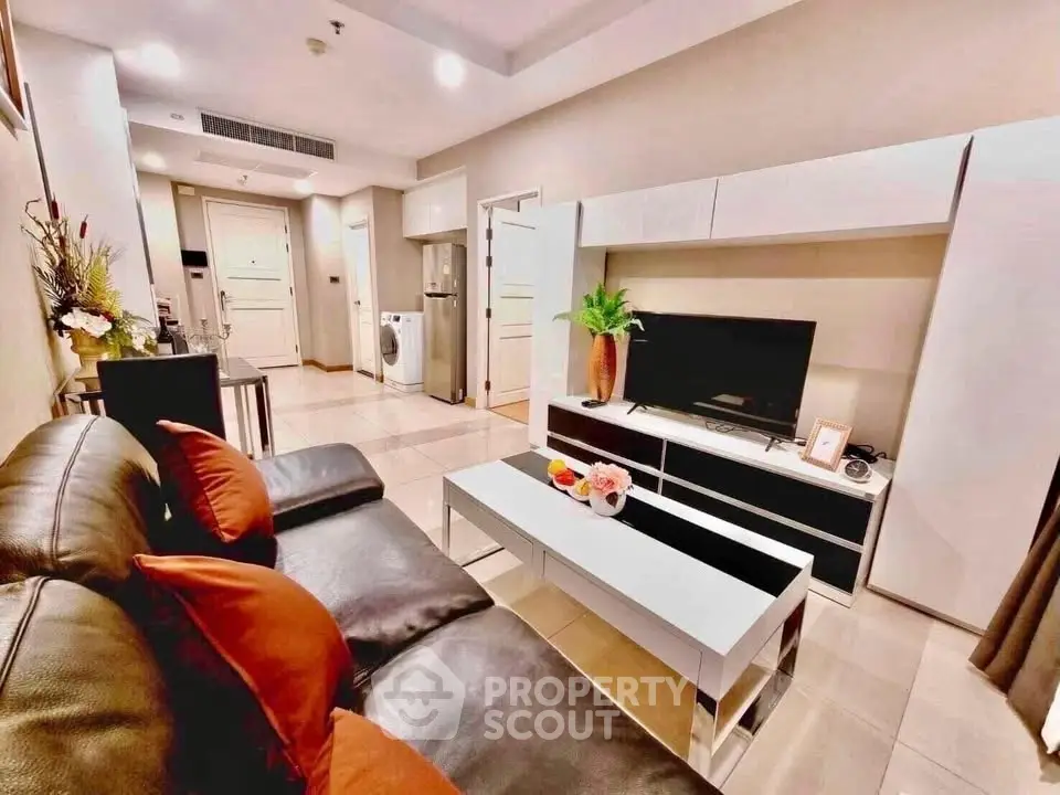 Modern living room with sleek furniture and open layout in a stylish apartment.