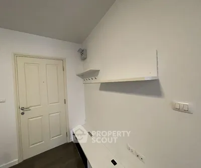 Minimalist interior with white walls and modern shelving