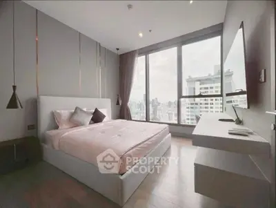 Modern bedroom with city view and sleek design in high-rise apartment