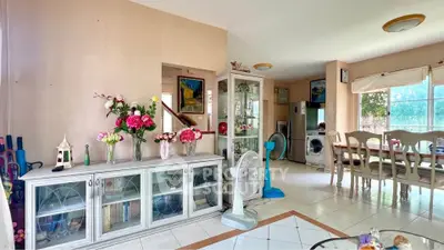 Spacious living and dining area with elegant decor and natural light.