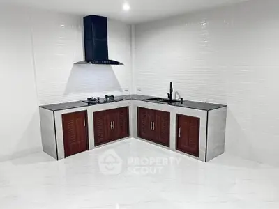 Modern kitchen with sleek cabinetry and gas stove in a stylish open layout