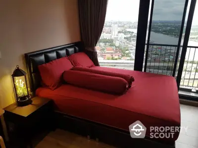 Luxurious bedroom with stunning city view and balcony access