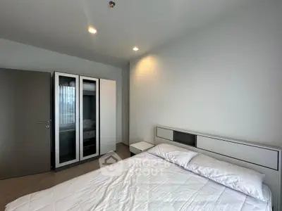 Modern bedroom with sleek design and ample natural light