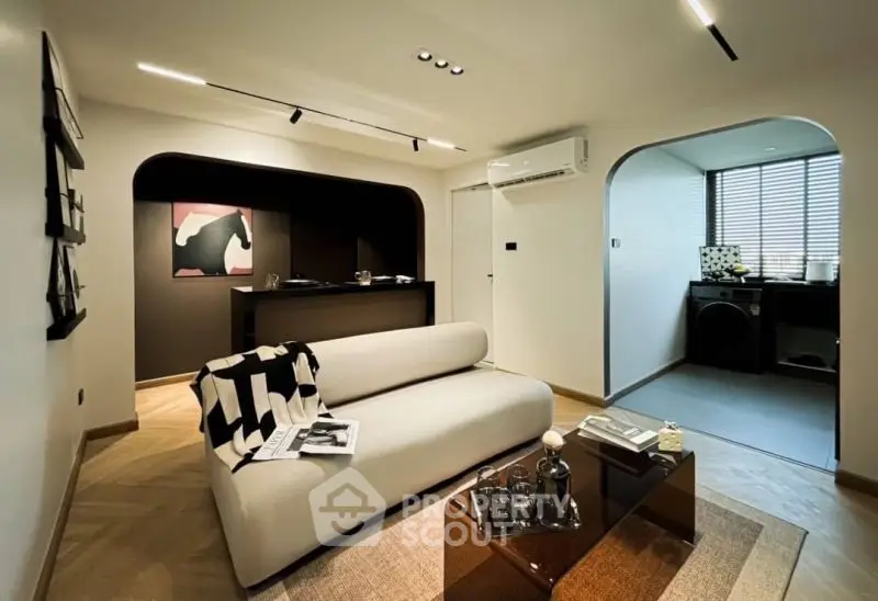 Modern living room with stylish decor and open kitchen layout