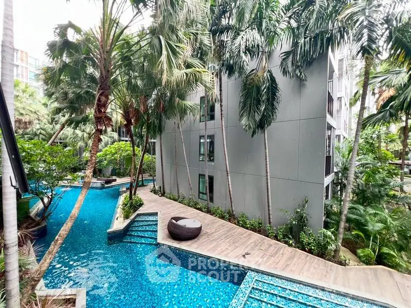 Luxurious condominium with stunning pool and lush tropical landscaping