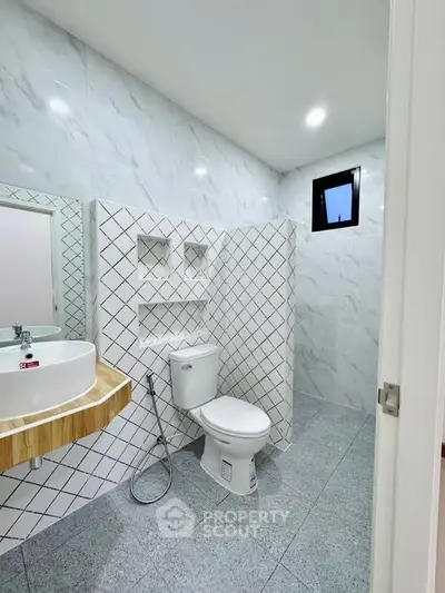 Modern bathroom with stylish tile design and sleek fixtures