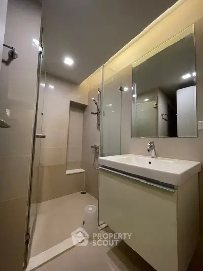 Modern bathroom with sleek design and glass shower enclosure