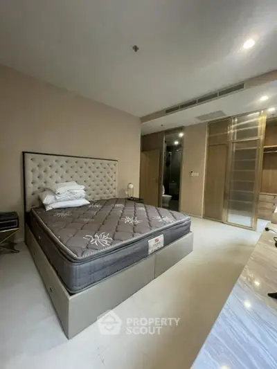 Spacious bedroom with modern design and ample natural light