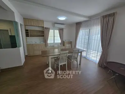 Spacious dining area with natural light and modern wooden flooring