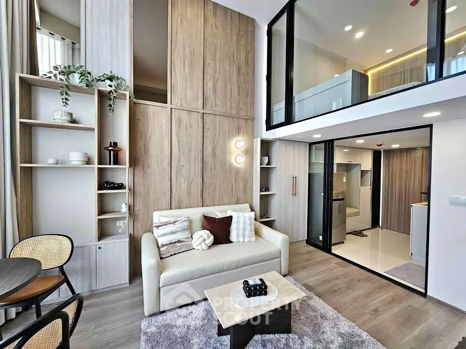 Modern loft-style living room with high ceilings and stylish decor