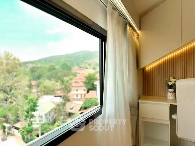 Bright study nook with scenic window view in modern apartment