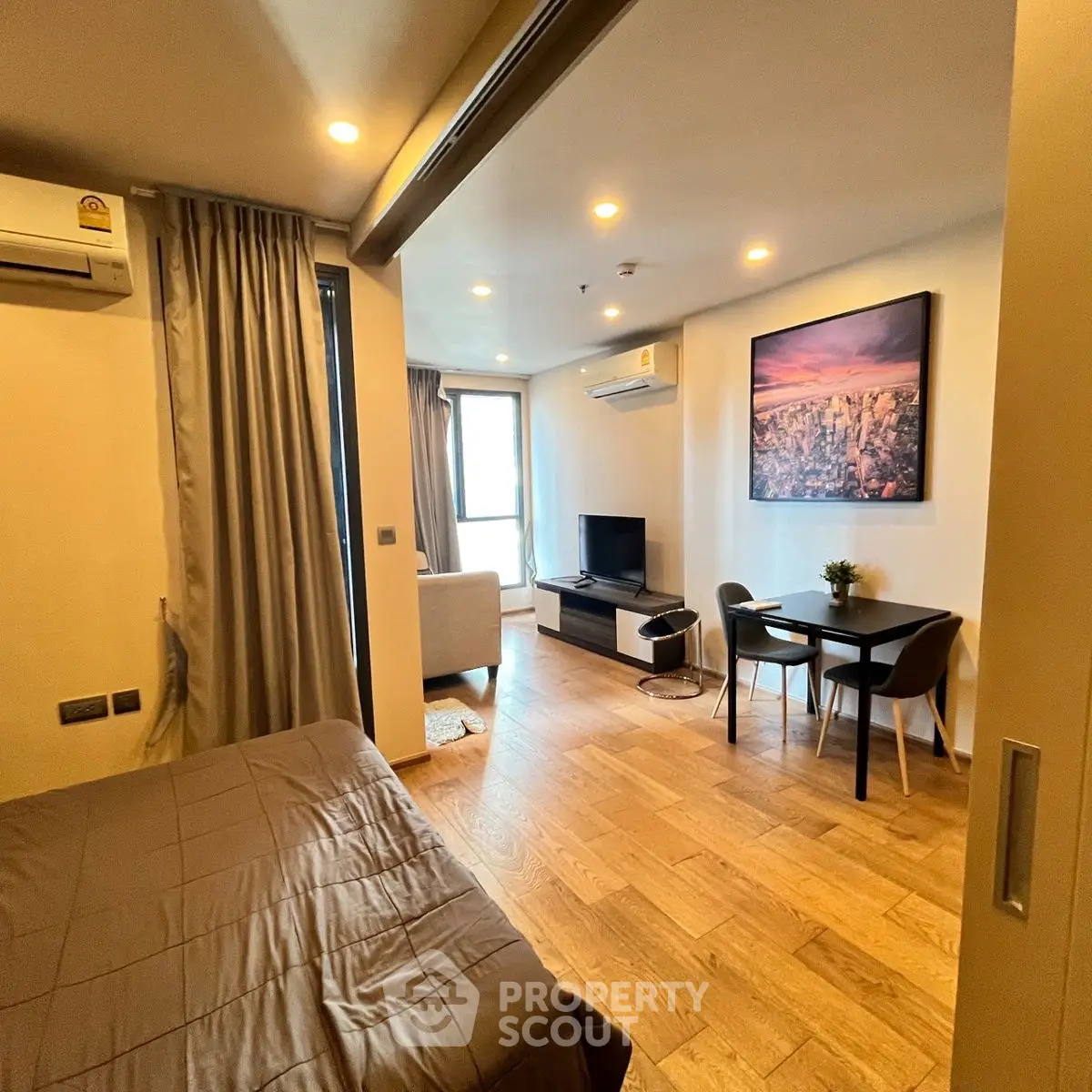 Modern studio apartment with cozy living area and stylish decor
