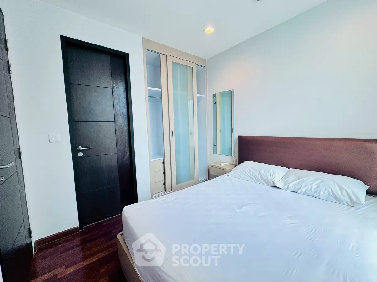 Modern bedroom with sleek design and ample storage space