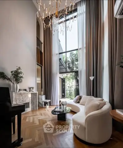 Luxurious living room with high ceilings and elegant decor