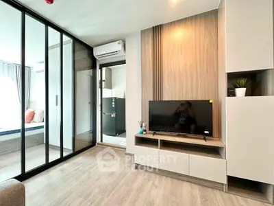 Modern living room with sliding glass doors and stylish decor