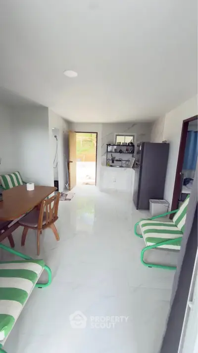 Bright and airy living room with modern furniture and open layout, perfect for relaxation and entertaining.