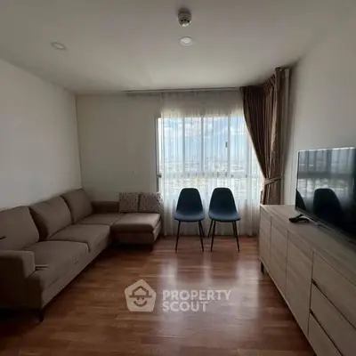 Modern living room with cozy sofa and city view