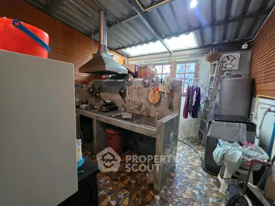 Charming rustic kitchen with unique stone flooring and open layout.