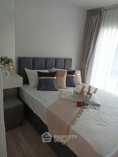 Cozy modern bedroom with stylish decor and natural light