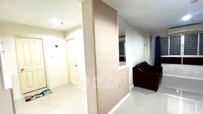 Spacious modern living room with sleek design and ample natural light