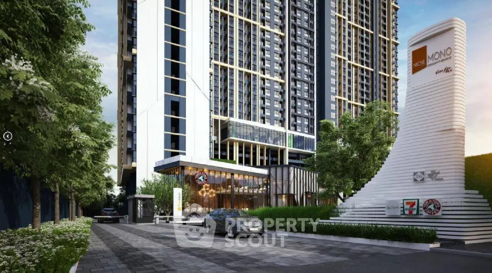 Modern high-rise building with sleek design and lush landscaping in urban setting.