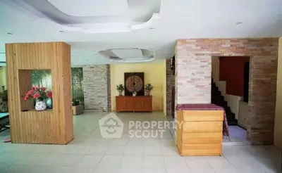 Spacious open-plan living area with modern decor and natural light