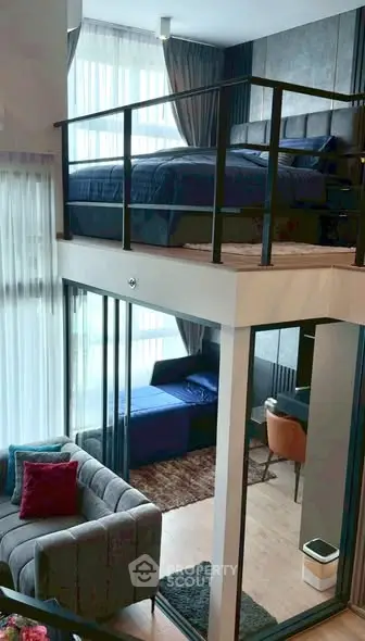 Modern loft apartment with stylish mezzanine bedroom and cozy living area.