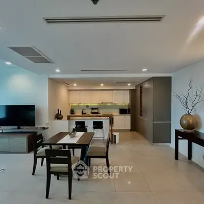 Spacious modern living room with open kitchen and elegant dining area