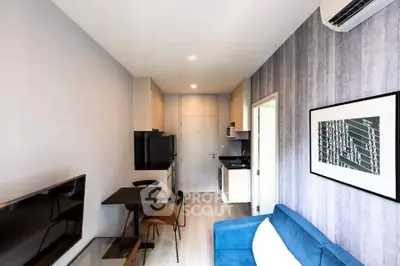 Modern living room with stylish decor and open kitchen layout