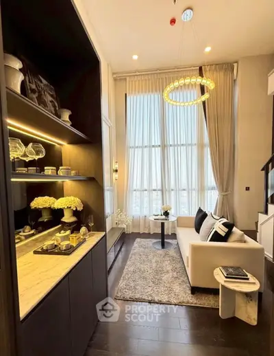 Luxurious living room with high ceilings, elegant decor, and large windows offering stunning views.