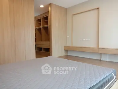 Modern bedroom with wooden built-in wardrobe and sleek design