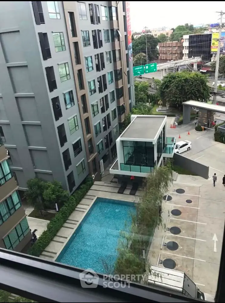 Modern condominium with pool and city view, ideal for urban living.