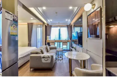 Modern studio apartment with open layout, featuring a cozy living area and stylish decor.