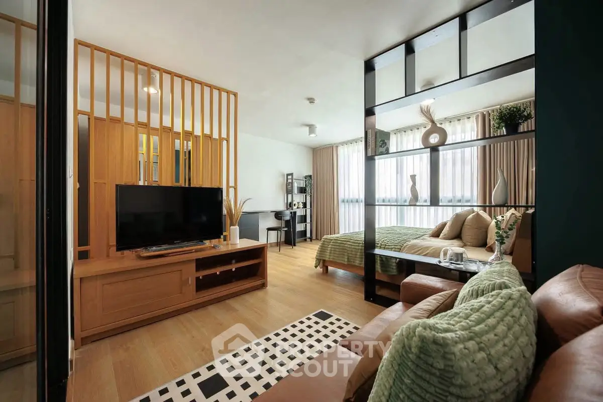 Modern open-plan living room with stylish decor and natural light