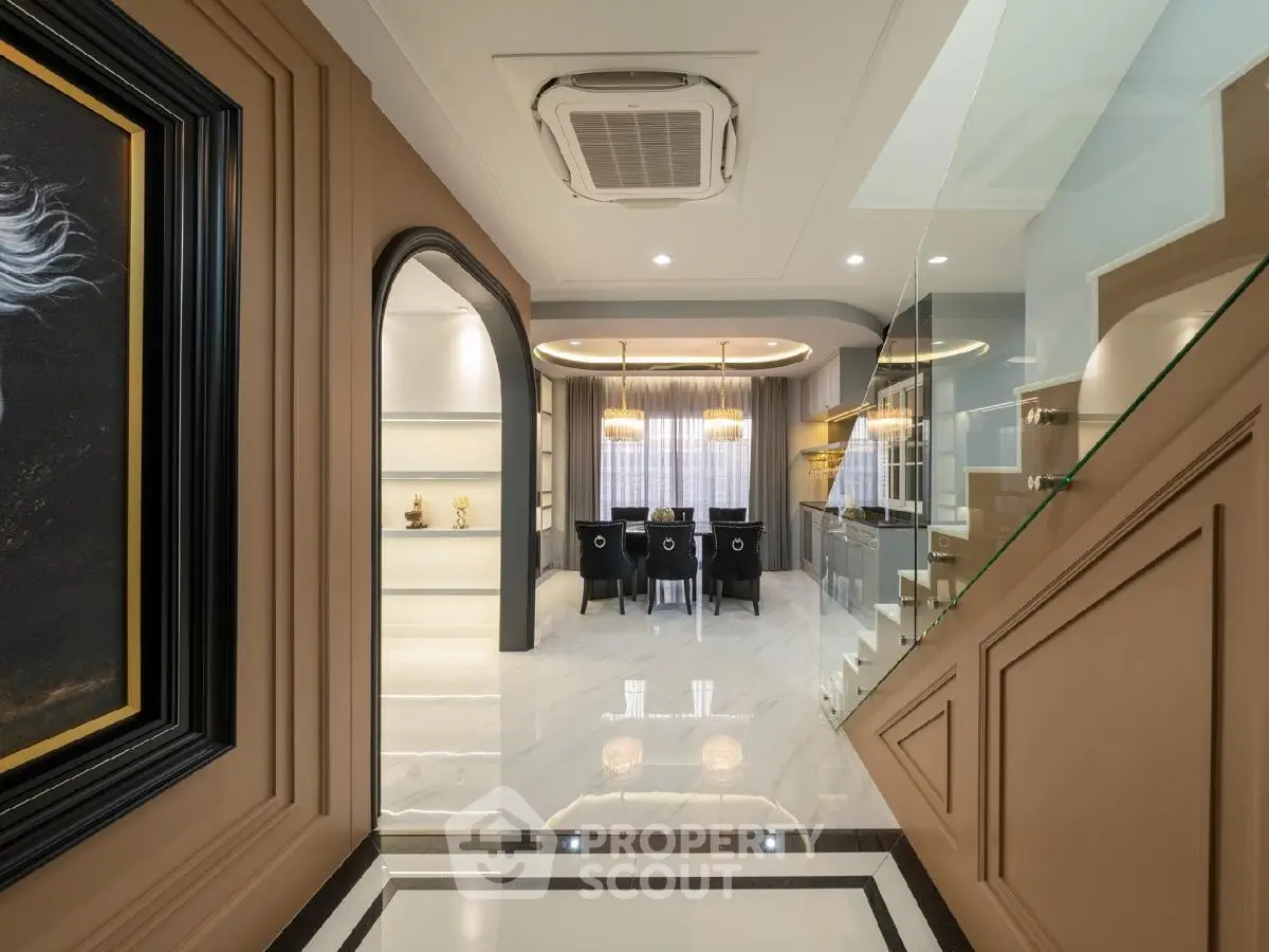 Luxurious modern kitchen with elegant dining area and stylish decor
