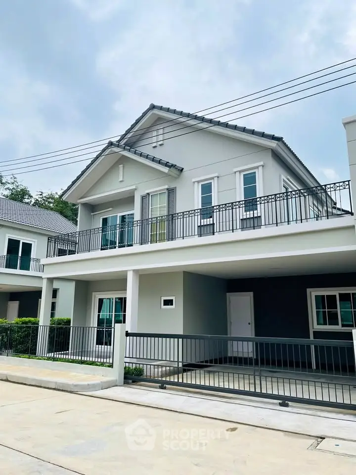 Modern two-story house with spacious balcony and contemporary design