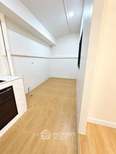 Spacious modern kitchen with sleek design and ample storage space
