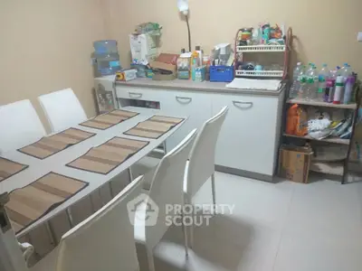 Cozy kitchen with dining table and ample storage space