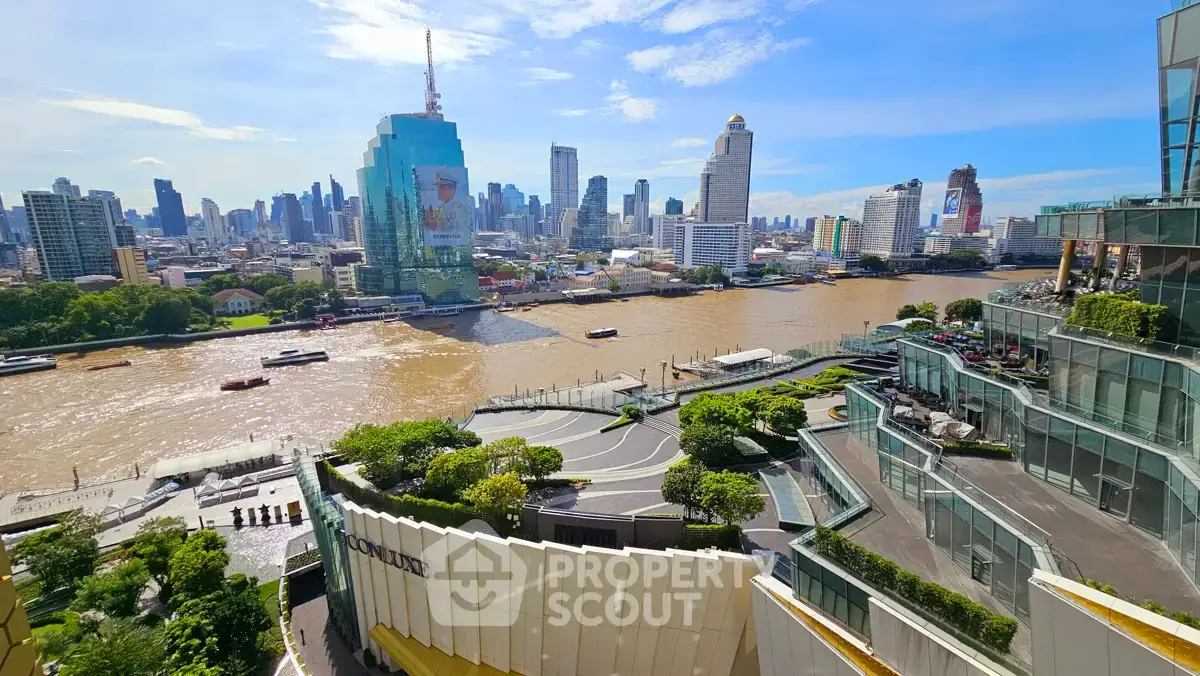 Stunning riverfront view of modern city skyline with lush greenery and luxury buildings.