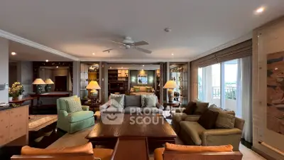 Luxurious and spacious living room with elegant furnishings and ample natural light.