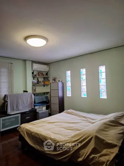 Cozy bedroom with natural light and modern furnishings