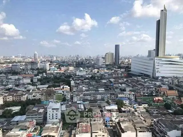 Stunning cityscape view showcasing urban skyline and architectural diversity under a clear blue sky.