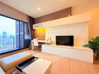 Modern living room with city view, featuring sleek furniture and large windows for natural light.