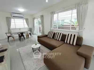 Spacious living room with modern furniture and natural light