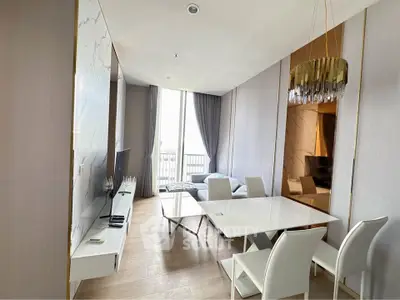 Modern living room with elegant dining area and large window view