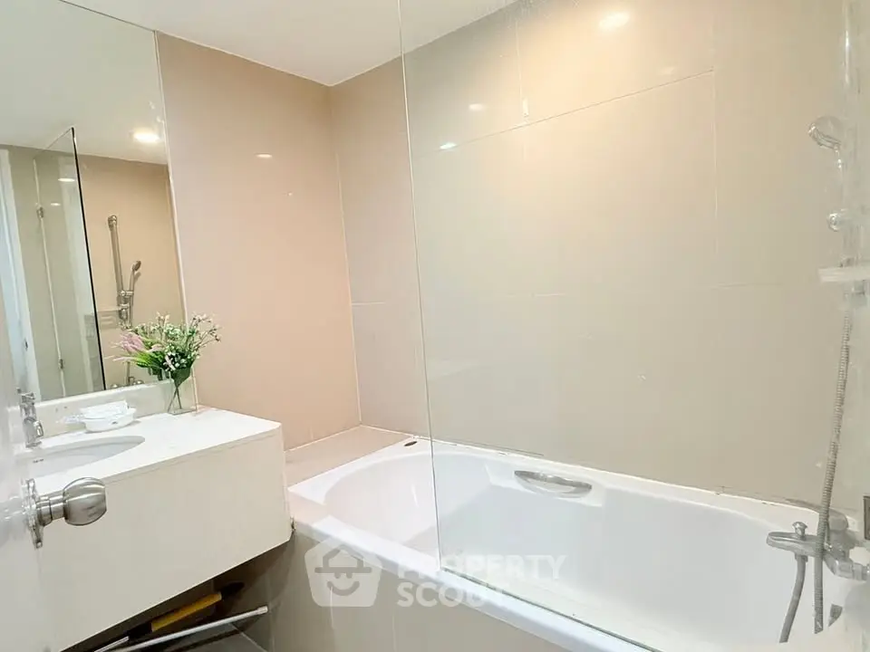 Modern bathroom with sleek design and bathtub in a contemporary apartment.