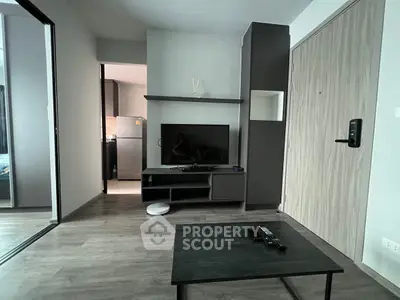 Modern living room with sleek furniture and open kitchen view