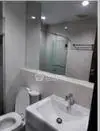 Modern bathroom with sleek fixtures and glass shower enclosure