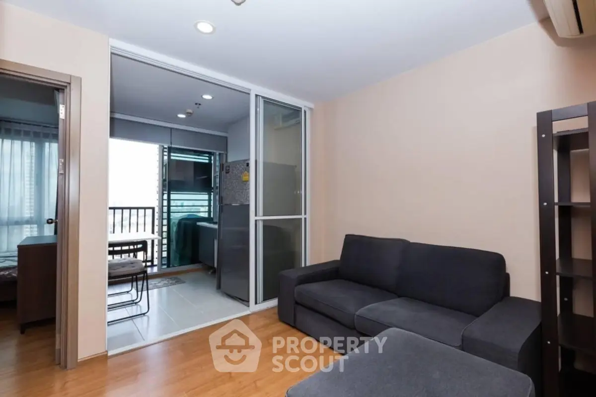 Modern living room with cozy sofa and balcony view in stylish apartment