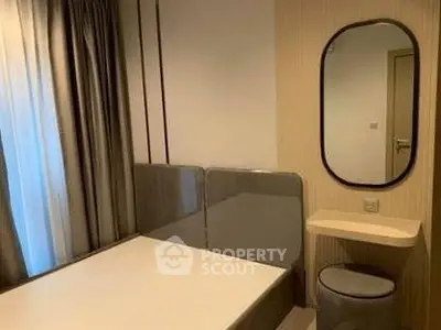 Cozy bedroom with modern decor and stylish mirror